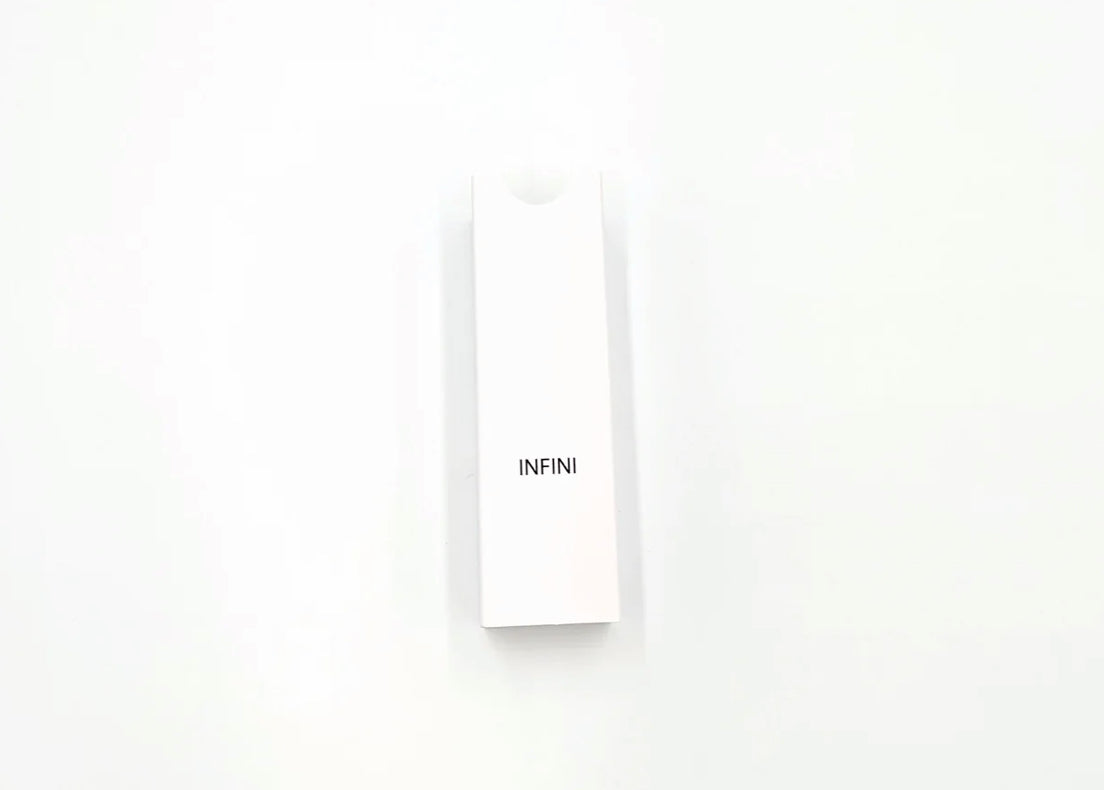 Minimalist white box labeled 'INFINI' for Lutronic Infini 49-pin microneedling tips, part of a 10-pack packaging for aesthetic clinics.