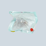Clear plastic bag with a red dot on a white background