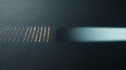 Abstract contrast between discrete energy points and a broad beam, representing RF microneedling versus laser