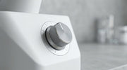 Precision adjustment dial on a neutral instrument in a clinical setting