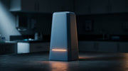 A matte monolithic form in cool light with a warm glow, evoking a Thermage console at rest in a clinic