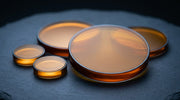 A graded set of warm translucent discs of different sizes, evoking Thermage treatment tips by surface area