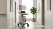 Professional aesthetic ultrasound console on castors in a bright clinic corridor