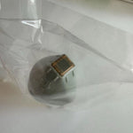 Angled view of Thermage CPT Eye Tip 0.25cm² – 450 Reps in sterile wrap, showing treatment surface and branding.
