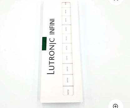 Open box of Lutronic Infini 49-pin microneedling tips showing individually packed cartridges, designed for RF skin treatment systems.