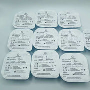 Multiple medical adhesive patches with text on a gray background